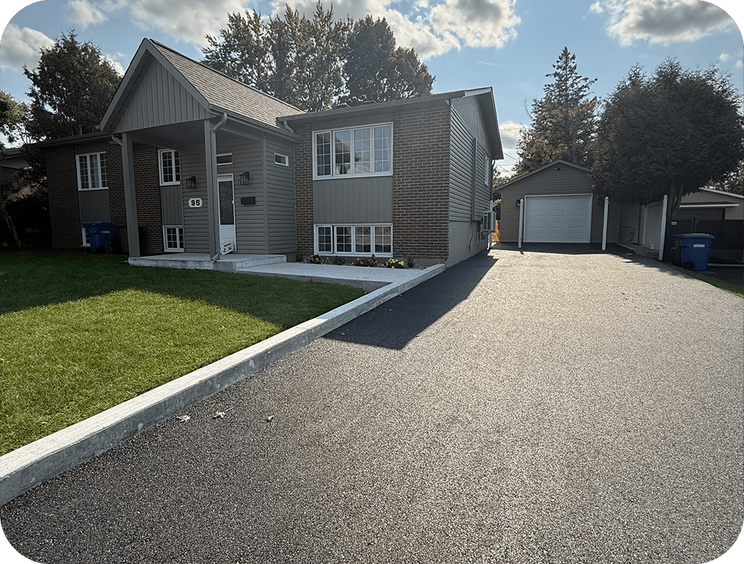 residential asphalt driveway paving in front of a house